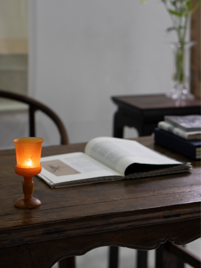 amber-hued Liuli glass candle holder