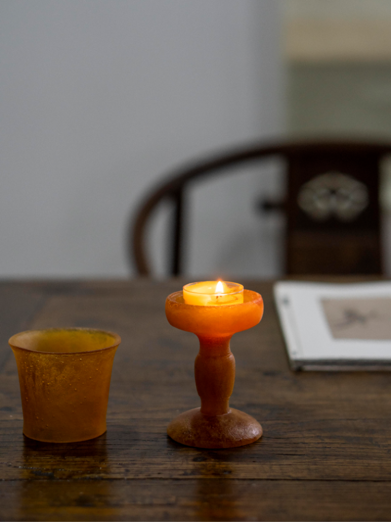 amber-hued Liuli glass candle holder