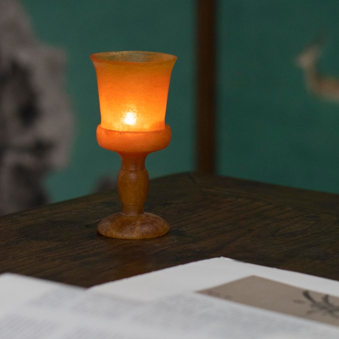 amber-hued Liuli glass candle holder