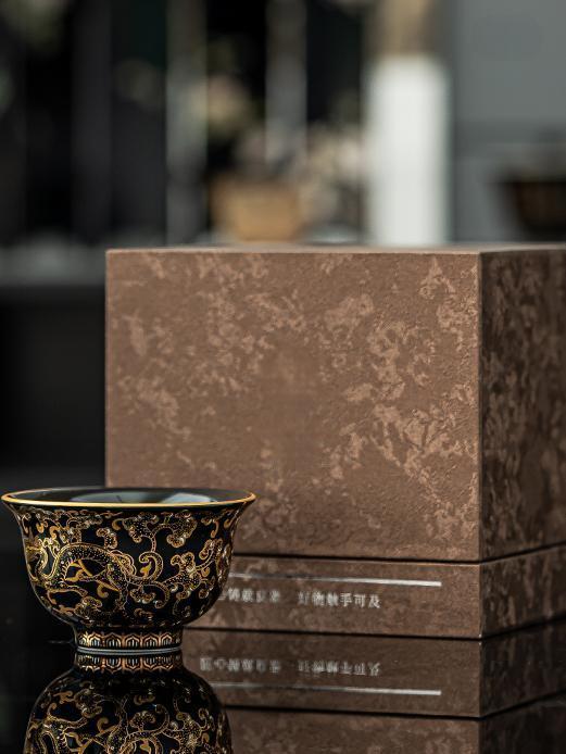 Imperial Black Porcelain Teacup with Gold Dragon Motif