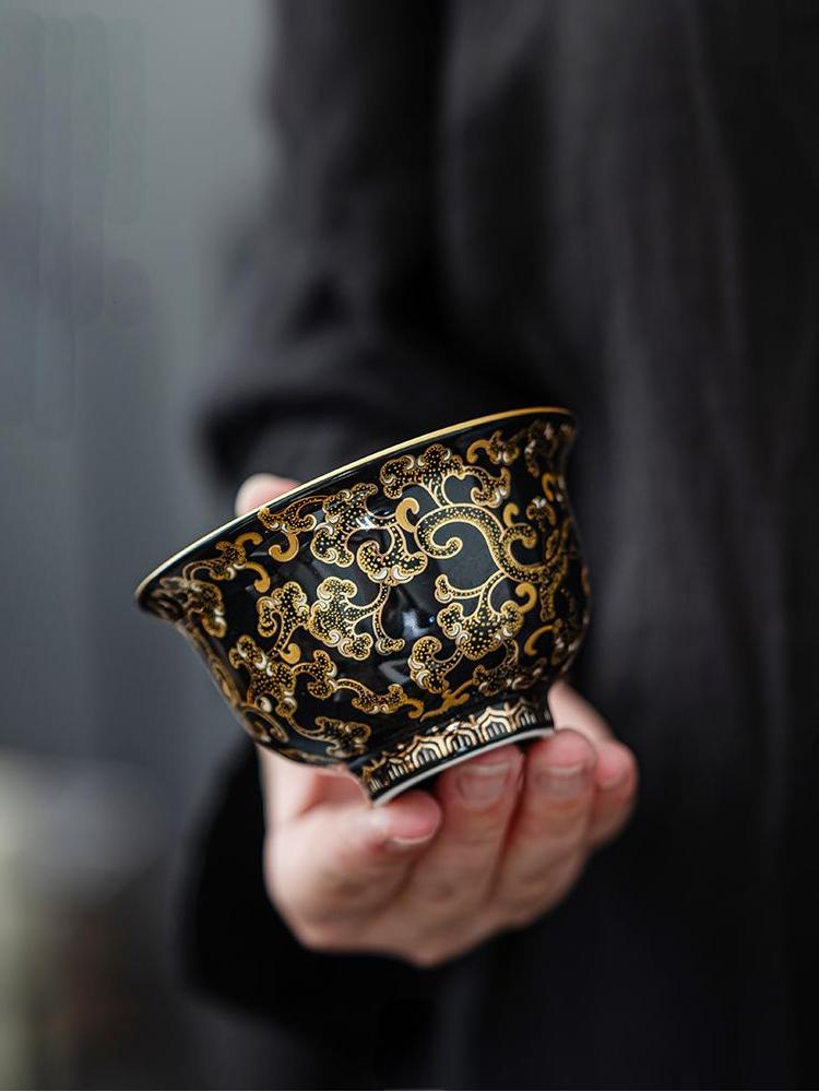 Imperial Black Porcelain Teacup with Gold Dragon Motif
