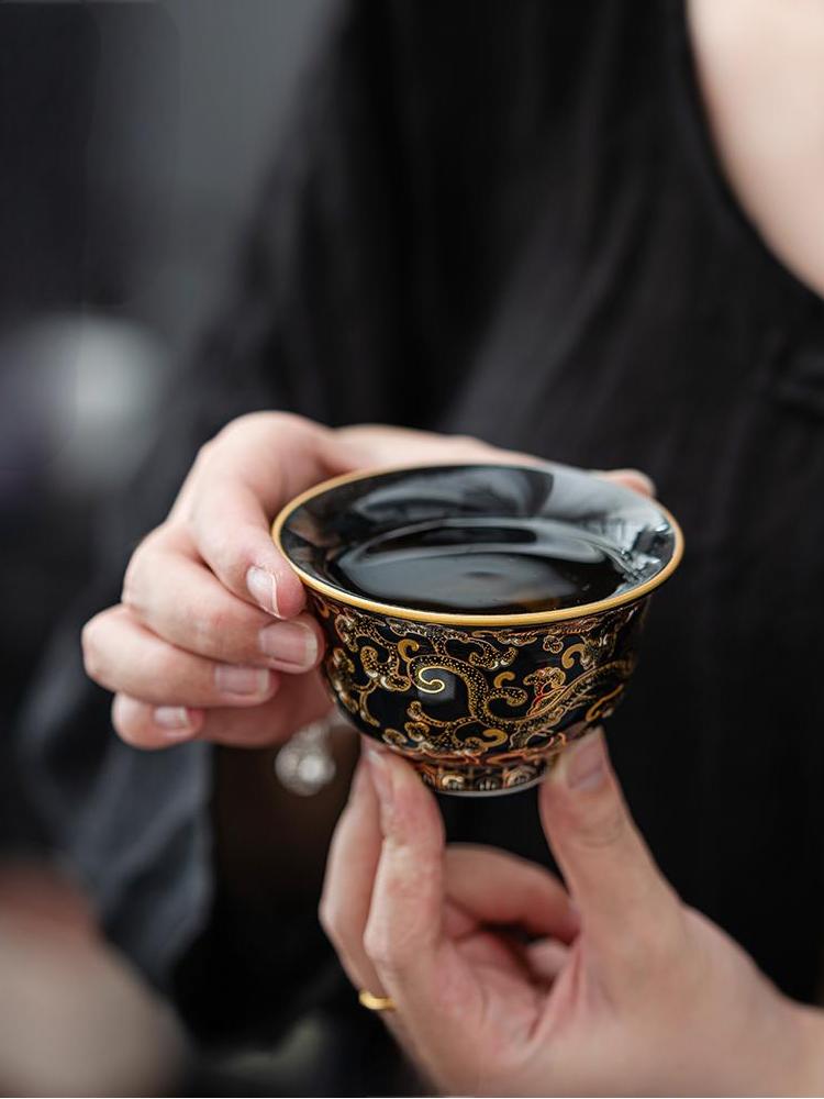 Imperial Black Porcelain Teacup with Gold Dragon Motif