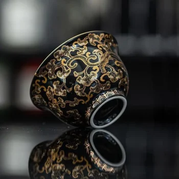 Imperial Black Porcelain Teacup with Gold Dragon Motif
