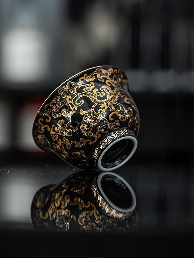 Imperial Black Porcelain Teacup with Gold Dragon Motif